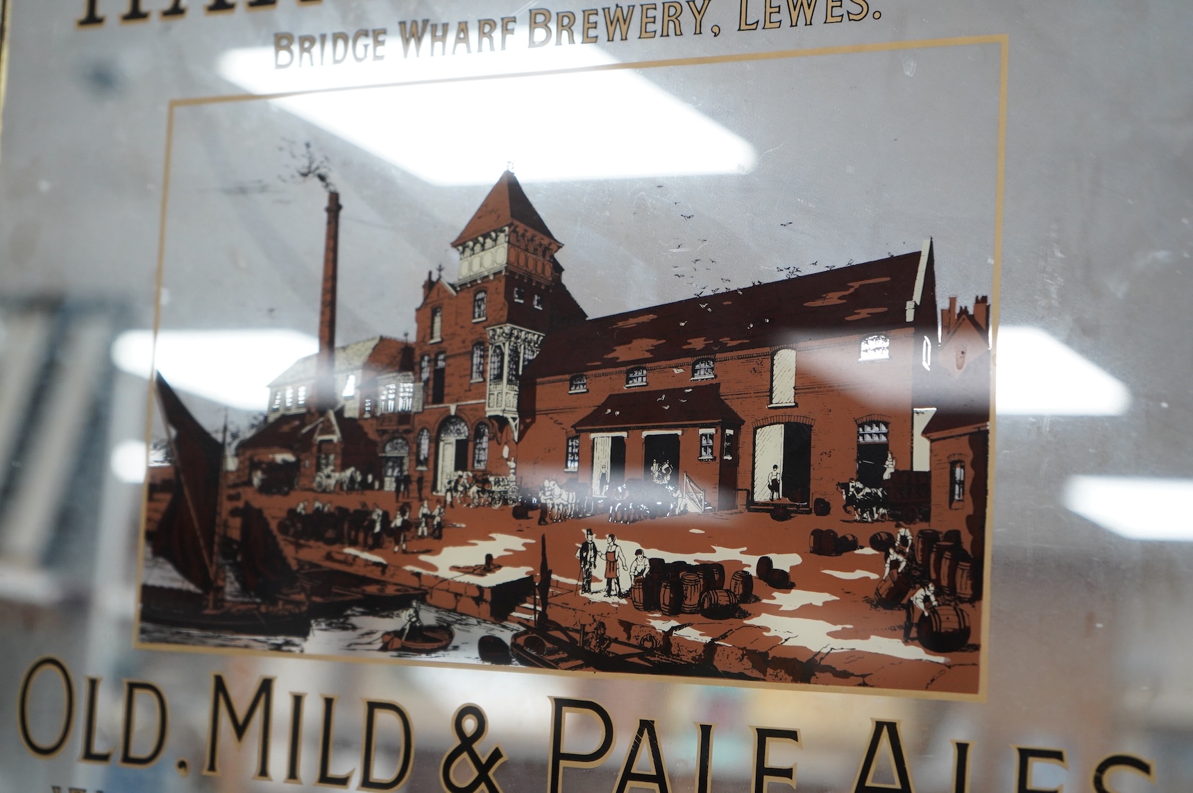Lewes interest, a decorative Harvey & Son brewery advertising mirrored sign, framed, 43 x 53cm